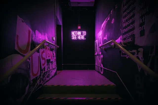 Corridor illuminated by purple neon light for how long do neon signs last